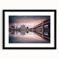Abstract art print of Pittsburgh skyline in vibrant colors on a large black framed canvas, ideal for living room decor.