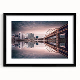 Abstract art print of Pittsburgh skyline in vibrant colors on a large black framed canvas, ideal for living room decor.