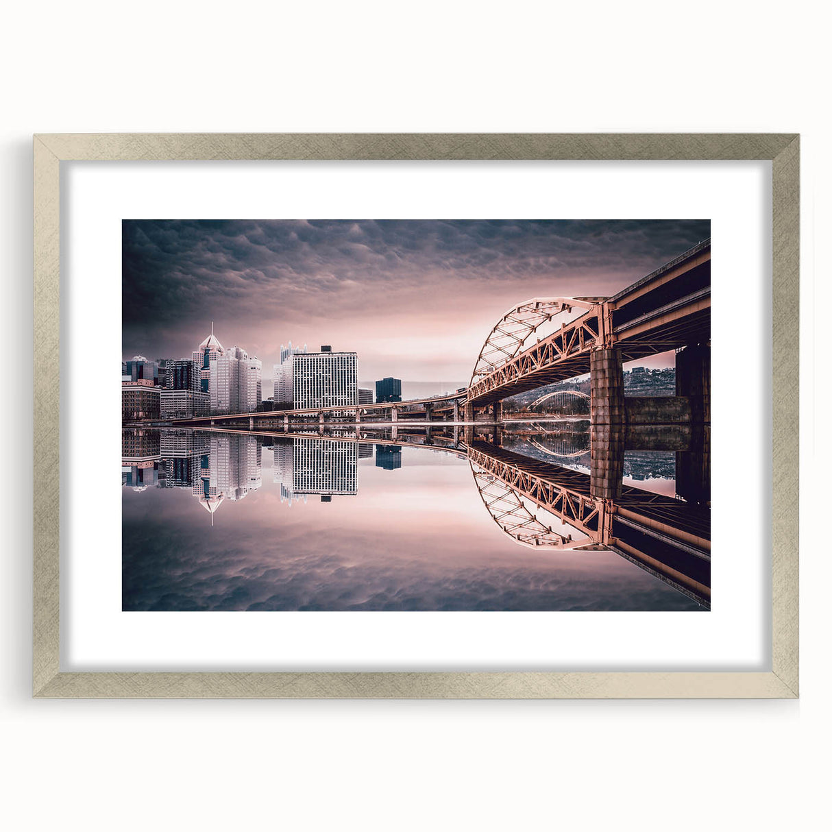 Textured art print of Pittsburgh skyline in abstract style with muted gray and blue tones, framed in silver.