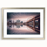 Textured art print of Pittsburgh skyline in abstract style with muted gray and blue tones, framed in silver.
