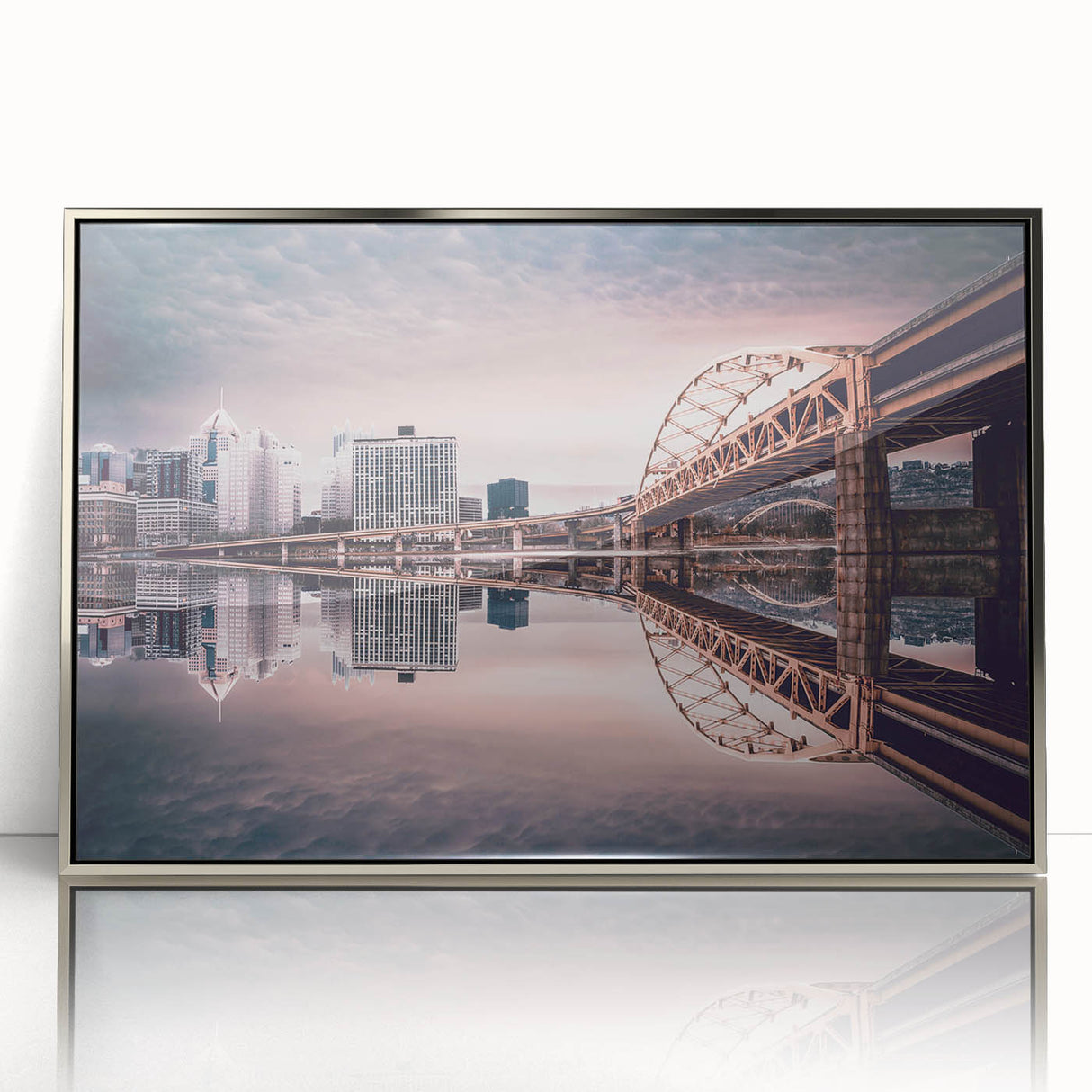 Mid-century modernist art of Pittsburgh skyline in silver framed acrylic, featuring muted gray and blue tones.