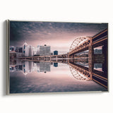 Framed canvas of Pittsburgh landscape in vibrant colors on a black background, ideal for office decor.