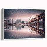 Vintage poster art of Pittsburgh skyline in colorful hues on extra large framed canvas, ideal for living room decor.