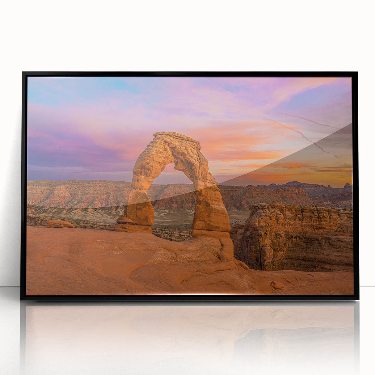 Large abstract wall art of Arches National Park in muted earth tones, framed in black acrylic.