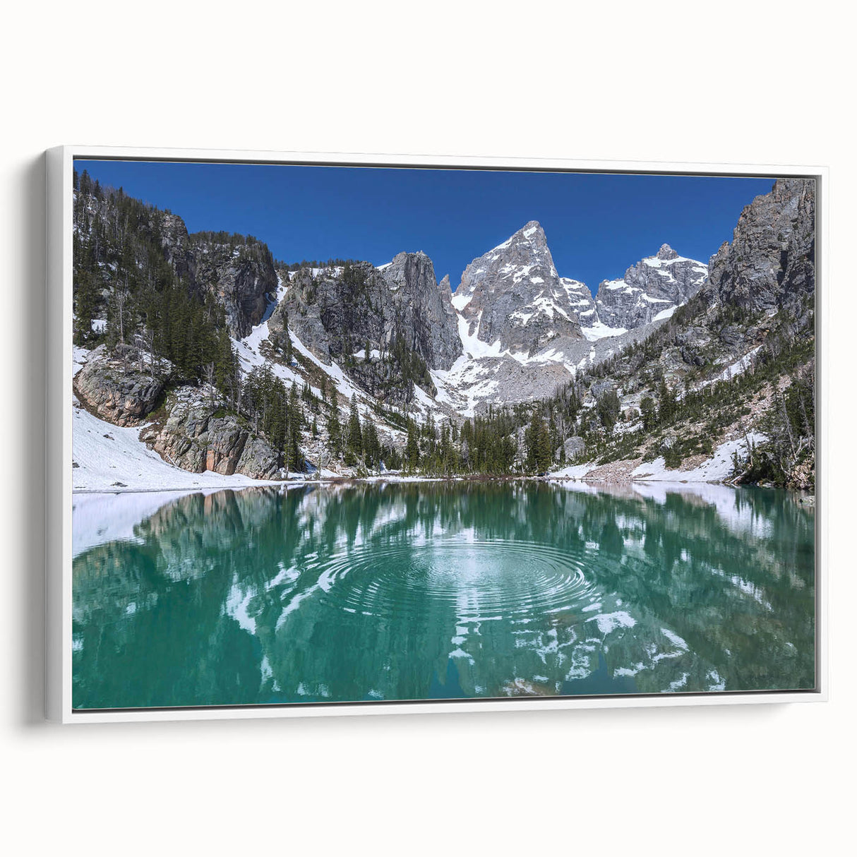 Vintage poster art of Grand Tetons on a framed canvas, featuring a black and colorful palette, ideal for living room decor.