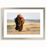 Textured art depicting abstract Yellowstone scenery in muted earth tones, framed in silver, ideal for bedroom decor.