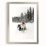 Textured art depicting a winter scene in abstract style, with cool blue and white tones on a silver-framed print.