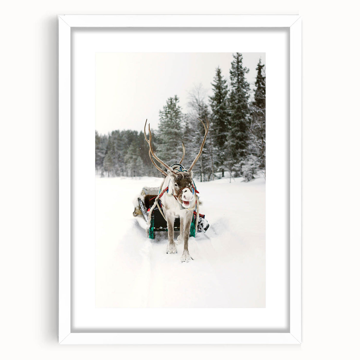 Abstract art print depicting a winter scene in muted gray and blue tones, framed with a white mat.