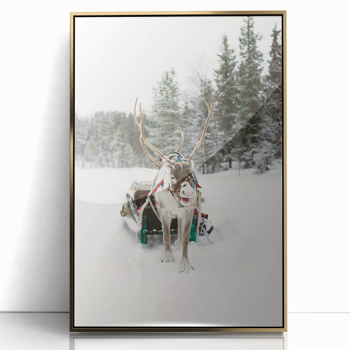 Mid-century modernist winter scene on large art print, framed in gold acrylic, with muted blue and white tones.