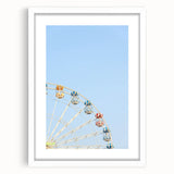 Abstract art print featuring swirling blue and white patterns, framed in white, ideal for dining room decor.