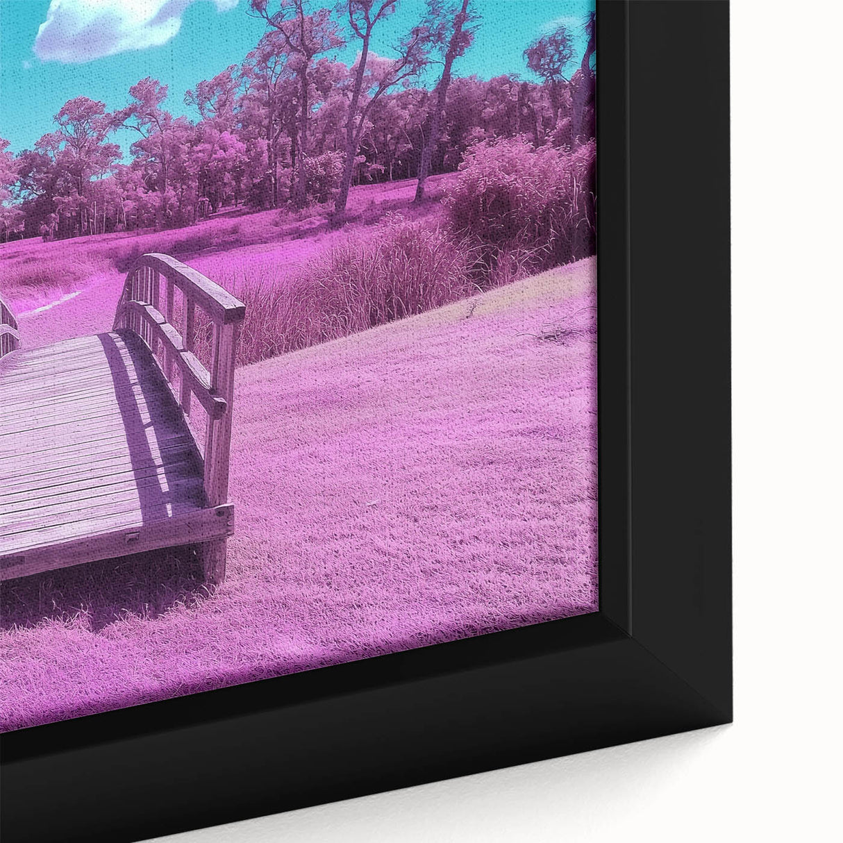 Close-up of a framed canvas print depicting a serene landscape bridge scene, showcasing vibrant colors and intricate details, ideal for home decor or art enthusiasts.