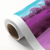 Rolled canvas artwork showcasing a vibrant landscape bridge design, featuring rich colors and intricate details, packaged securely in a durable cardboard tube for safe shipping and display.