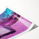 Rolled print of a landscape bridge artwork showcasing vibrant colors and intricate details, securely packaged in a protective cardboard tube for easy transport and display.