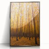 Mid-century modernist art depicting an abstract fall landscape in orange and brown tones, framed in silver acrylic.