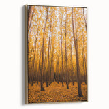 Framed canvas depicting a vintage-style landscape with autumnal trees in gold and black tones, ideal for bedroom wall art.