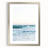 Textured abstract art print in vibrant orange and yellow tones on a silver-framed canvas, ideal for bedroom wall decor.