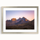 Framed landscape artwork depicting dramatic cliffs in silver matting, showcasing natural beauty and depth, perfect for home or office decor.