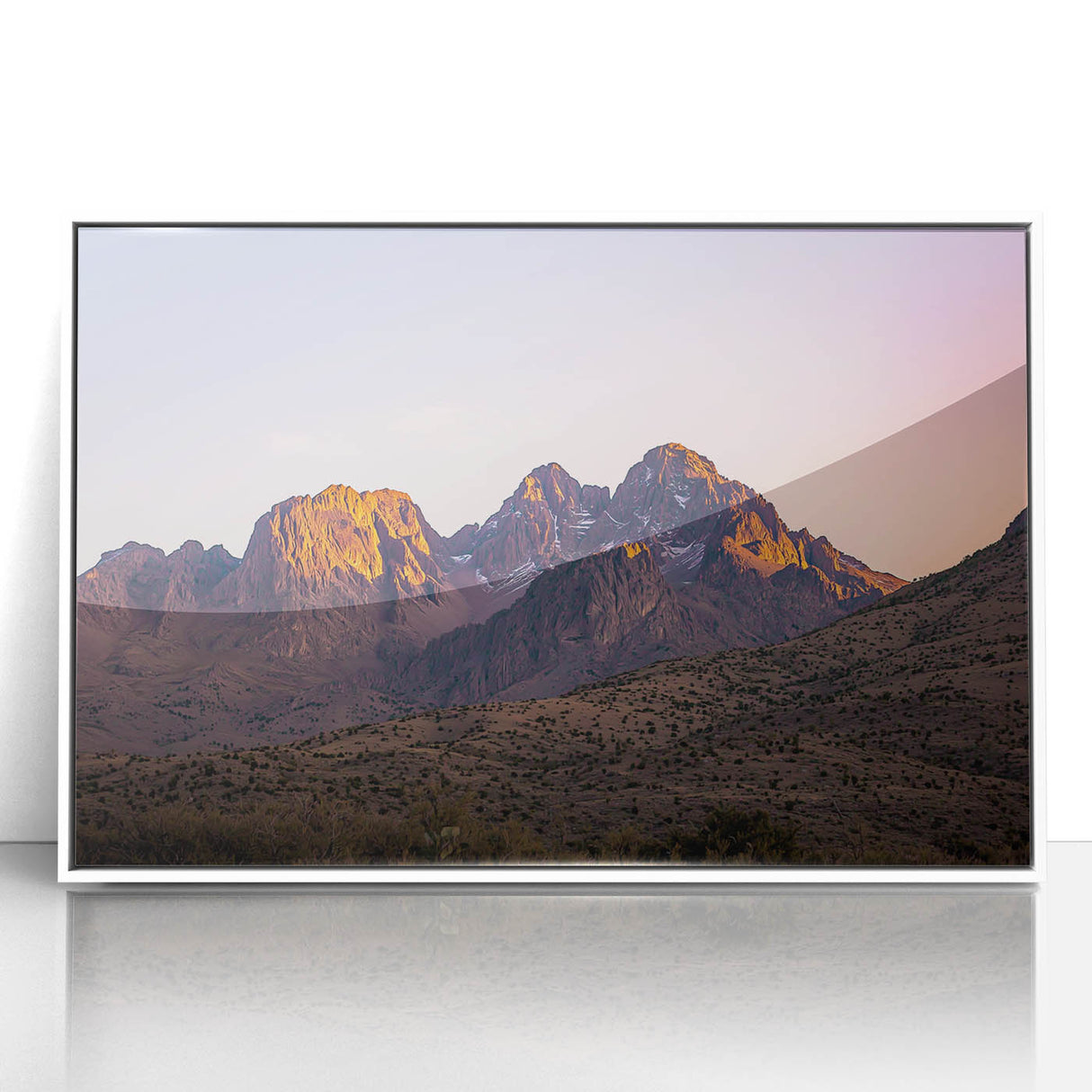 Framed acrylic artwork of a rugged landscape with cliffs, featuring a white frame, ideal for modern home decor. The vibrant colors enhance the natural beauty of the scene.