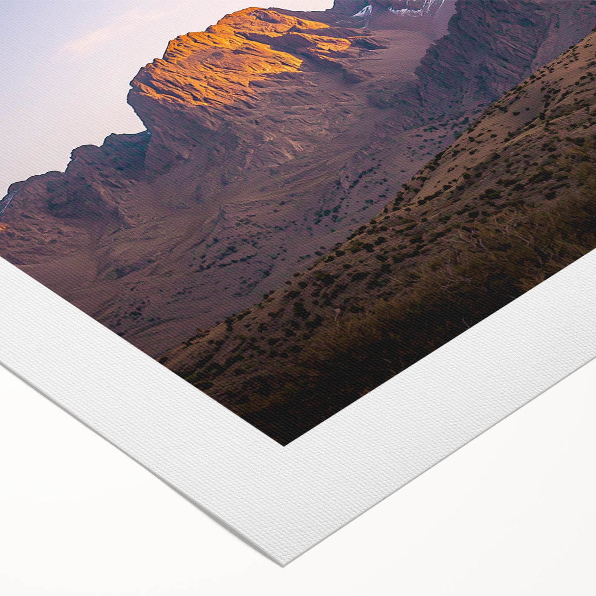 Vibrant rolled canvas showcasing a stunning landscape of cliffs under a clear blue sky, ideal for home decor, art collectors, and nature enthusiasts.