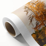 Art deco style poster featuring an autumnal tree with orange and yellow leaves on a rolled canvas.