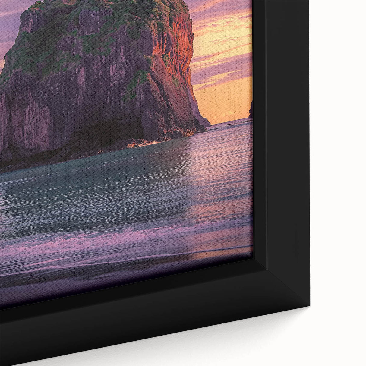 Framed canvas artwork showcasing a stunning close-up of rugged coastal cliffs at sunset, highlighting rich hues of orange and blue in a serene landscape. Ideal for home decor.