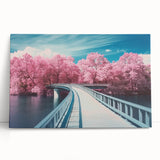 Stretched canvas depicting a serene landscape bridge over a tranquil river, showcasing vibrant greenery and a clear blue sky, perfect for home decor.