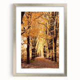 Textured art depicting abstract fall foliage in warm orange and brown tones on a framed canvas, ideal for bedroom decor.