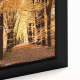 Close-up of a textured, extra large framed canvas depicting autumnal trees in a forest.