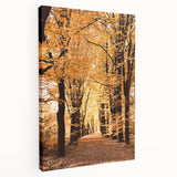 Side view of a large stretched canvas depicting a fall landscape with warm orange and brown tones.