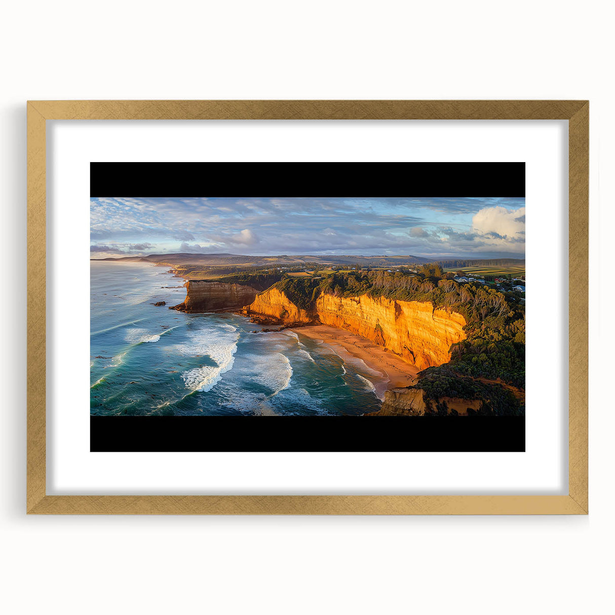 Elegant gold-framed landscape artwork showcasing dramatic cliffs against a serene sky, perfect for enhancing home decor with a touch of sophistication.