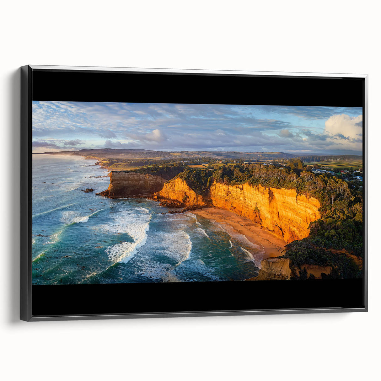 Framed canvas artwork showcasing a serene landscape of cliffs, featuring rich colors and textures, displayed with a sleek black frame, ideal for modern home decor.
