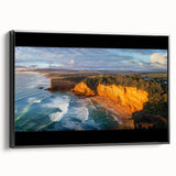 Framed canvas artwork showcasing a serene landscape of cliffs, featuring rich colors and textures, displayed with a sleek black frame, ideal for modern home decor.