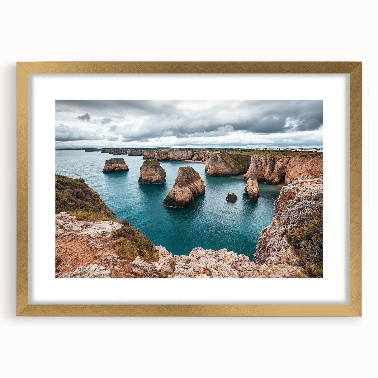 Elegant gold-framed landscape artwork depicting dramatic cliffs under a vibrant sky, enhanced with a white mat for a sophisticated presentation; perfect for home decor.