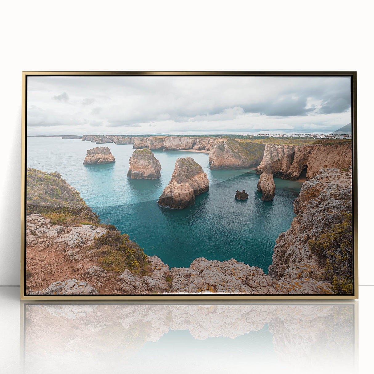 Framed acrylic artwork depicting a stunning landscape of cliffs under a vibrant sunset, featuring rich gold accents, perfect for modern home decor.