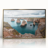 Framed acrylic artwork depicting a stunning landscape of cliffs under a vibrant sunset, featuring rich gold accents, perfect for modern home decor.