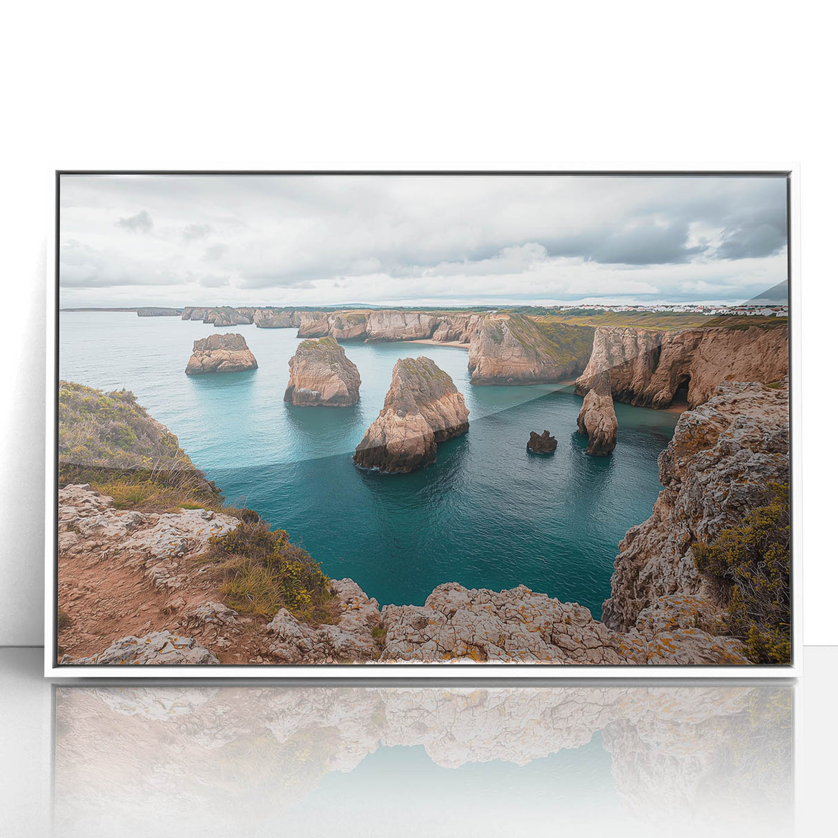 Framed acrylic artwork depicting dramatic cliffs and landscapes in vibrant colors, set against a sleek white frame, ideal for modern home decor.
