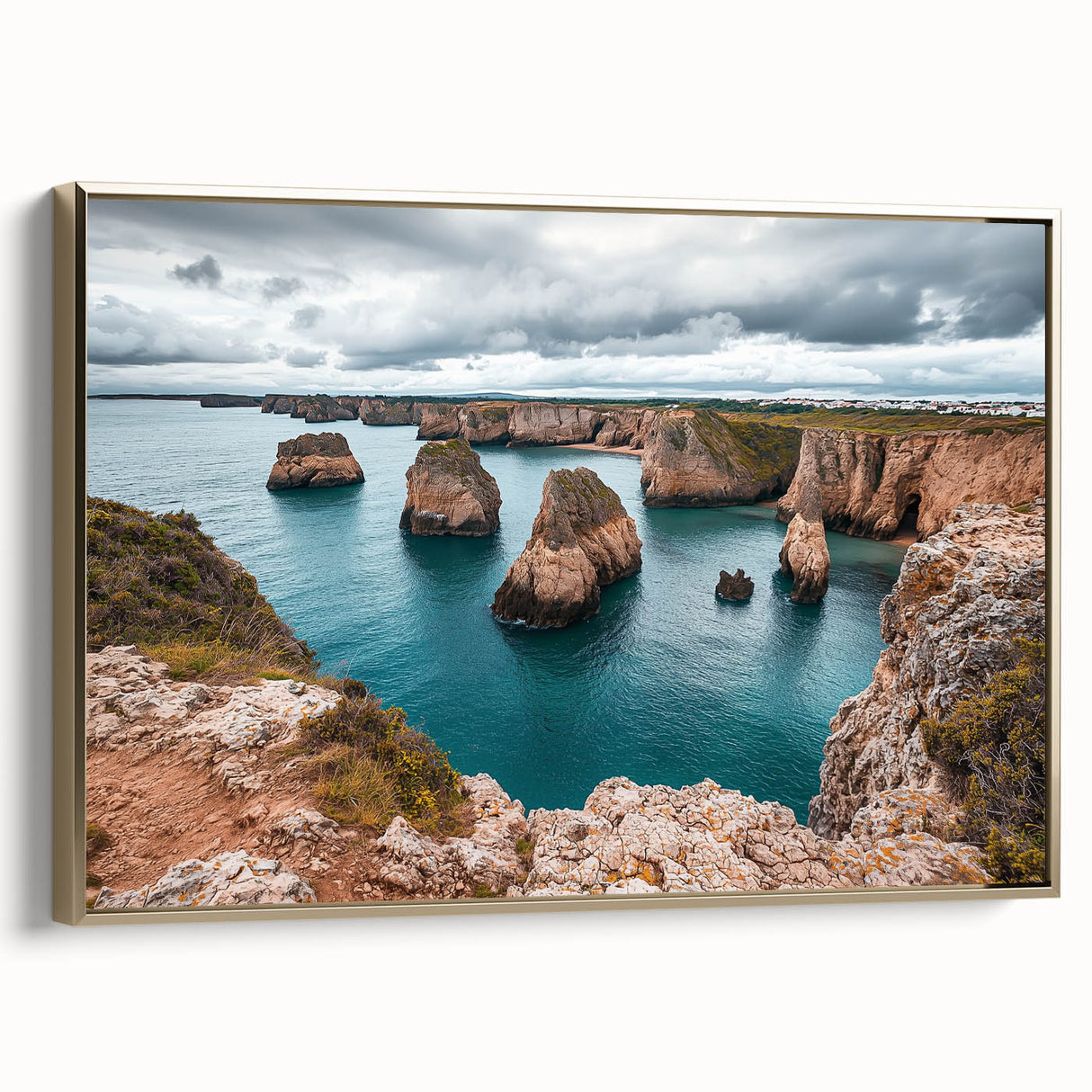 Framed canvas artwork showcasing dramatic cliffs in a vibrant landscape, featuring a gold side frame that enhances its elegance, perfect for home decor.