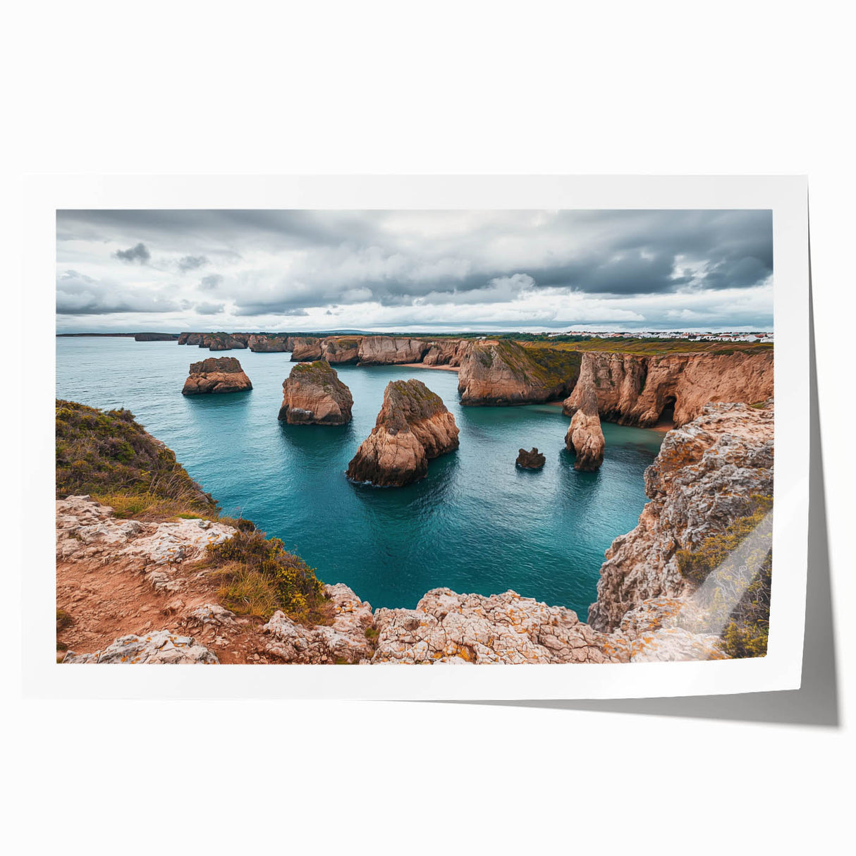 Stunning rolled print of dramatic cliffs at sunset, showcasing vibrant orange and purple hues, ideal for landscape art enthusiasts and home decor lovers.