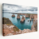 Stretched canvas artwork depicting a breathtaking landscape of majestic cliffs against a vibrant sunset, showcasing rich colors and dramatic textures, ideal for home decor.