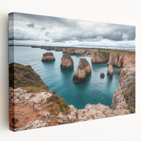 Stretched canvas artwork depicting a breathtaking landscape of majestic cliffs against a vibrant sunset, showcasing rich colors and dramatic textures, ideal for home decor.