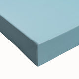 Large art of a black and white landscape painting on stretched canvas, featuring leafless trees in a foggy field.