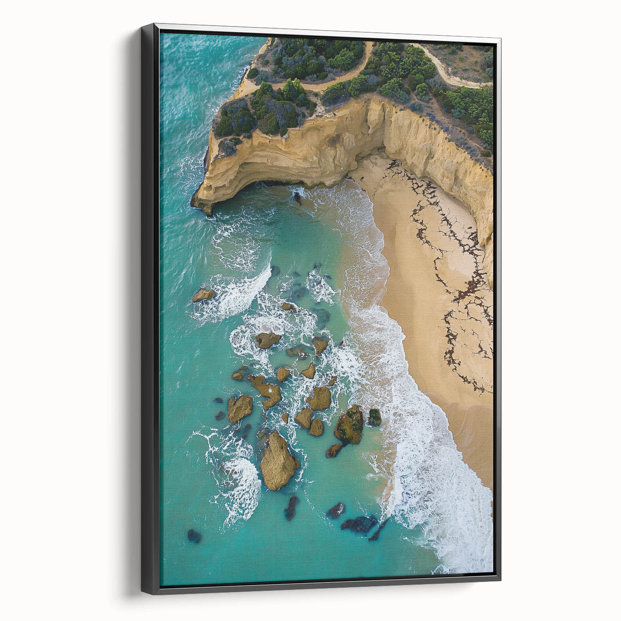Framed canvas art depicting dramatic cliffs and landscapes in rich colors, showcasing a black side view. Ideal for enhancing modern interior decor with nature-inspired elegance.