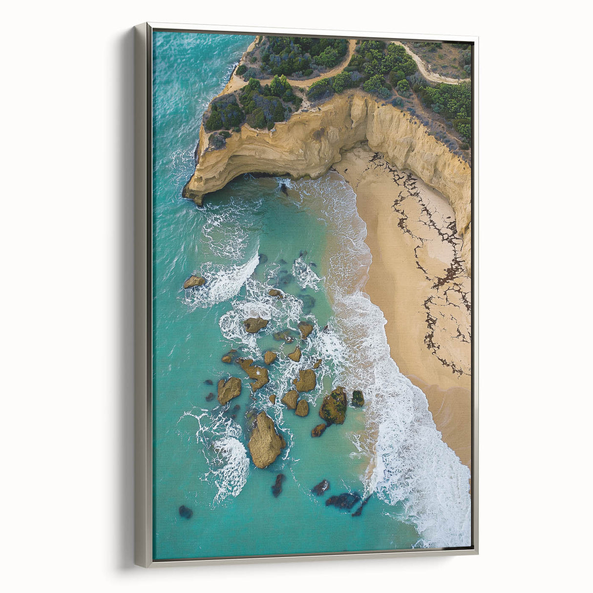 Framed canvas artwork showcasing a stunning landscape of cliffs, featuring silver accents and a side view perspective, ideal for home decor enthusiasts.