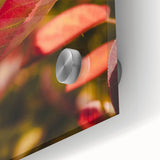 Large abstract wall art in muted orange and brown tones on acrylic glass.