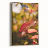 Framed canvas featuring a vintage-style landscape painting with autumnal trees in gold and black tones.