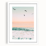 Abstract art print featuring swirling patterns in warm orange and yellow tones on a white framed canvas.