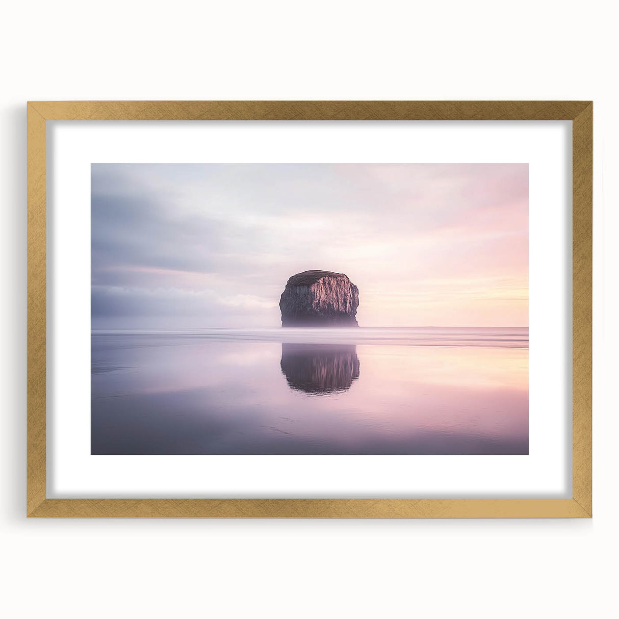 Elegant gold-framed landscape artwork featuring dramatic cliffs and serene ocean waves, perfect for enhancing any home decor. The mat adds depth and sophistication.