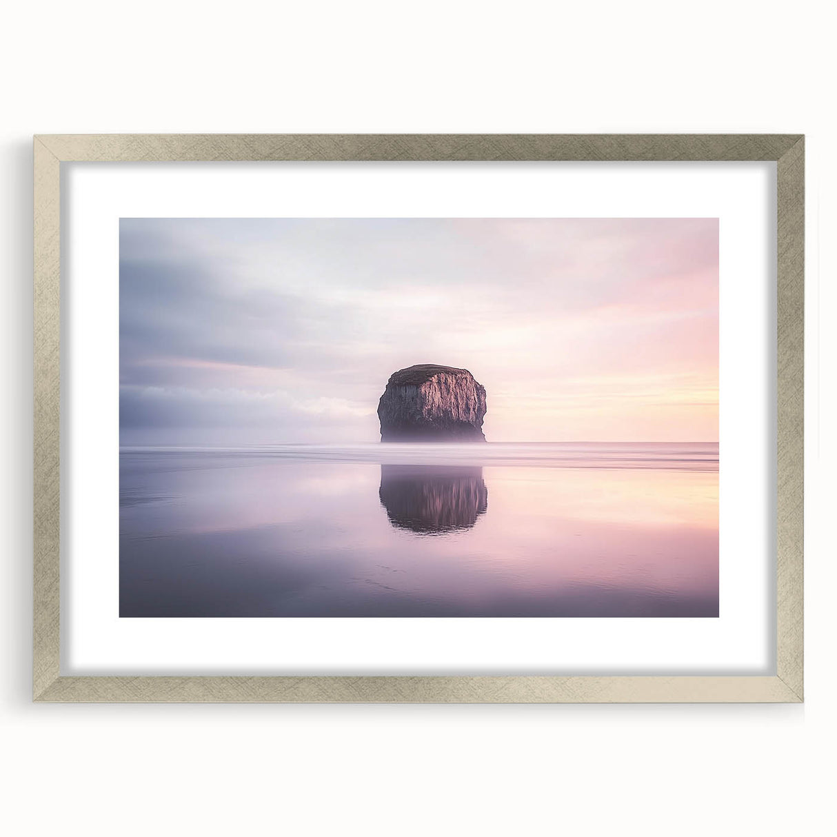 Framed landscape artwork showcasing a scenic cliff view, featuring a silver mat and frame, perfect for enhancing home decor with natural beauty and elegance.