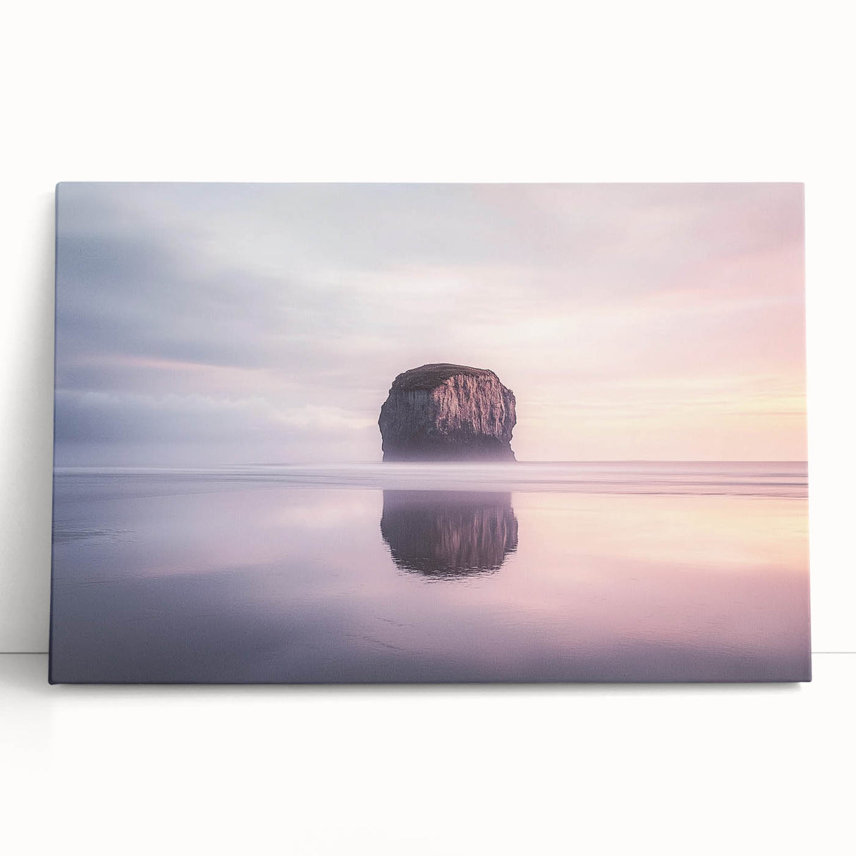 Stretched canvas artwork depicting a scenic landscape of towering cliffs against a vibrant sunset, ideal for home decor or office ambiance. Perfect for nature lovers.