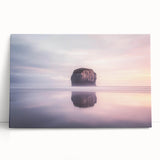 Stretched canvas artwork depicting a scenic landscape of towering cliffs against a vibrant sunset, ideal for home decor or office ambiance. Perfect for nature lovers.